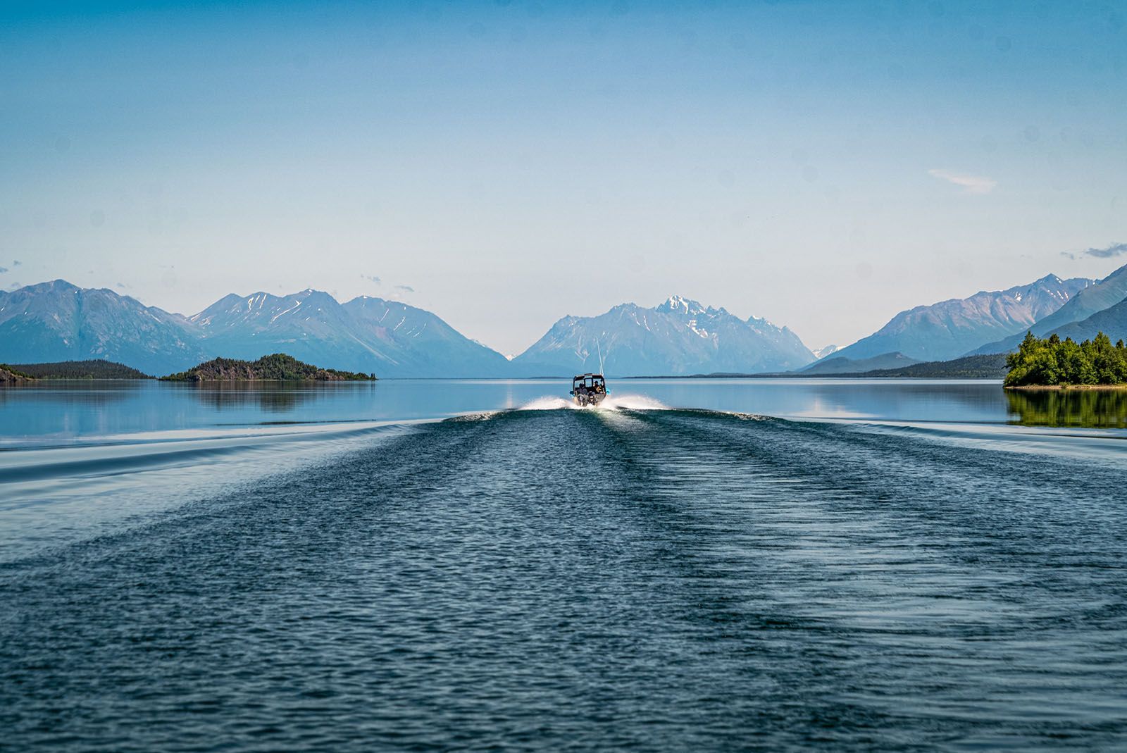 Mountain View of Boating on Lake Clark